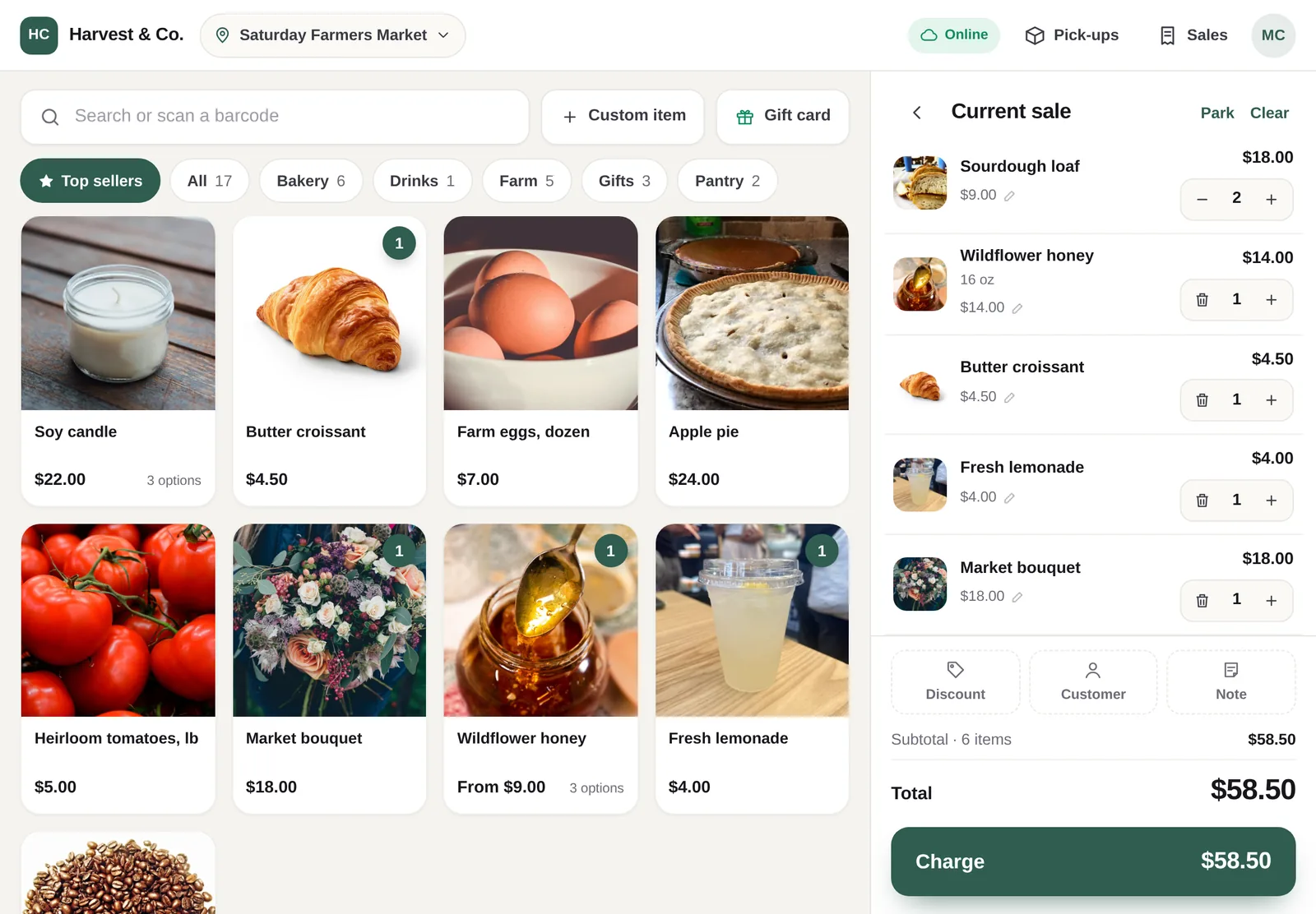 The Luminos POS register on a tablet: product photos and categories on the left, the current sale with quantities and a Charge button on the right.